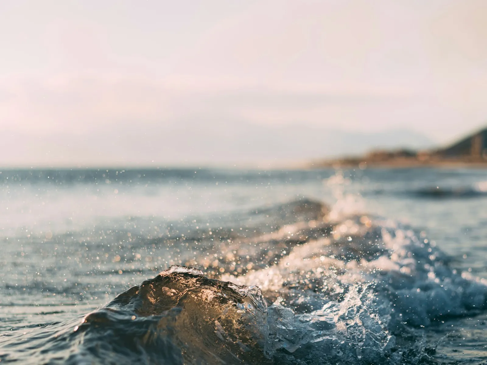 A wave breaking over a rock